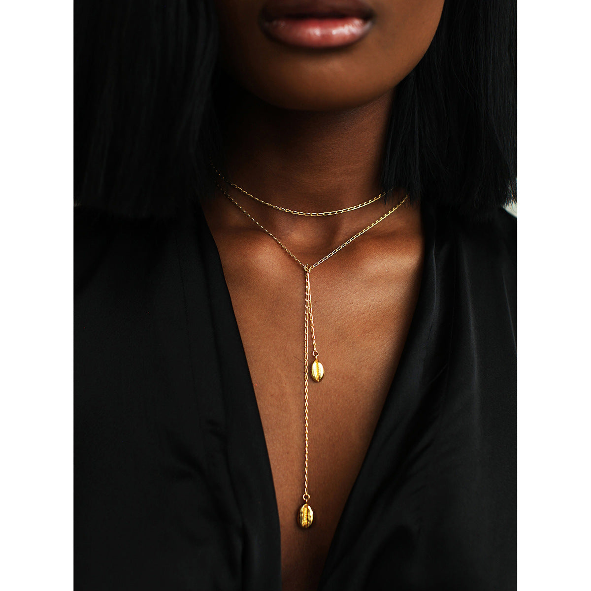 Thin gold adjustable chain necklace (110cm length, 0.8cm width) shown in layered styling 32