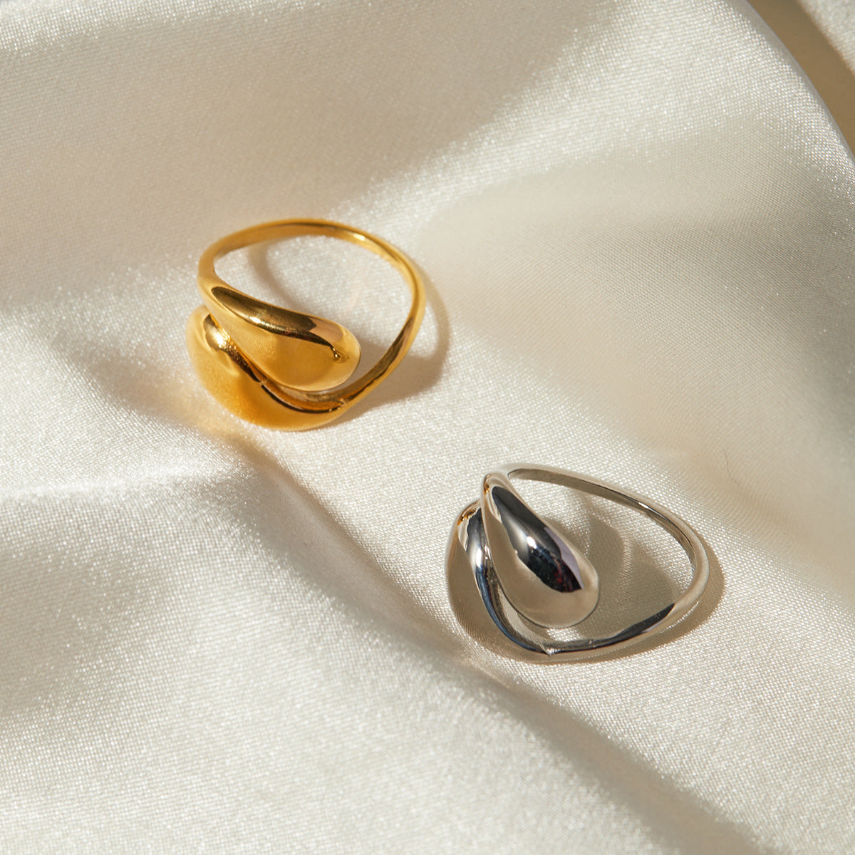 Adjustable teardrop-shaped gold and silver ring with 8mm waterdrop design by Arza Accessories, perfect for everyday or party wear 3