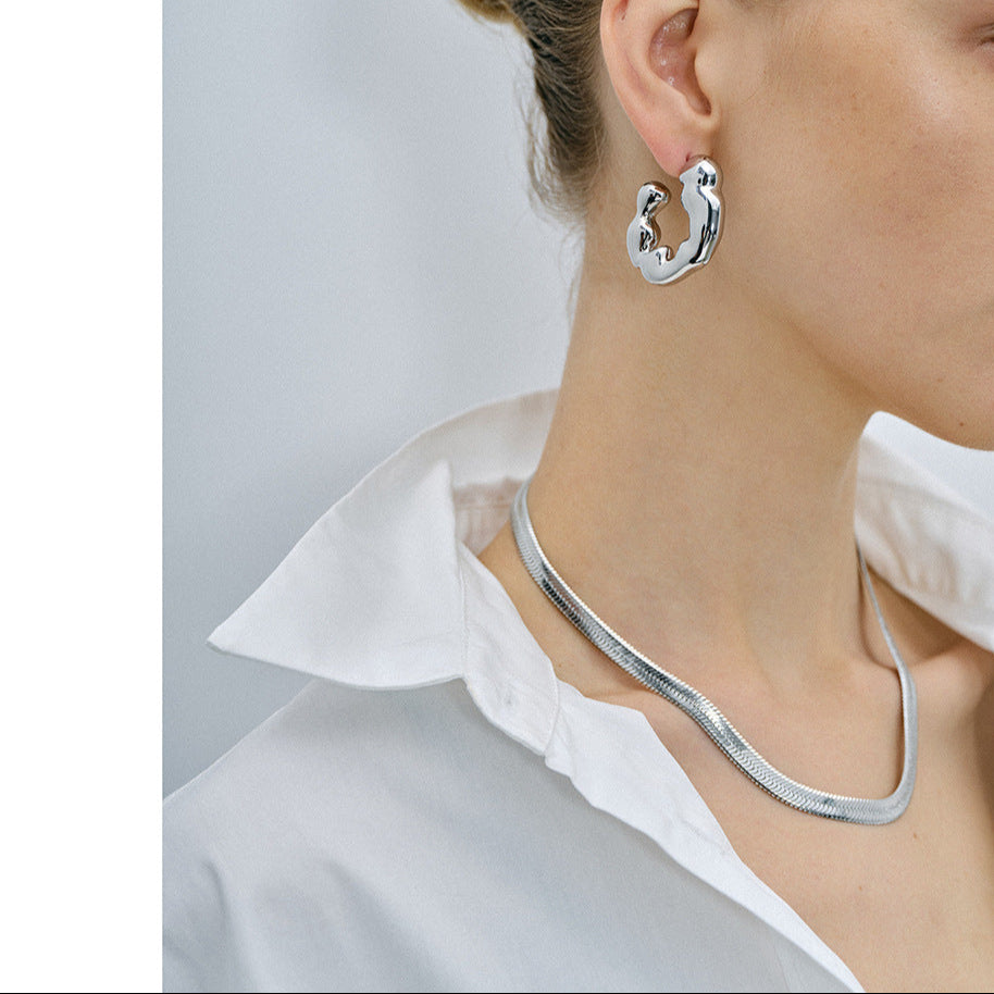 Trendy 3.8cm gold and silver two-tone hoop earrings by Arza Accessories - waterproof stainless steel everyday and party jewelry