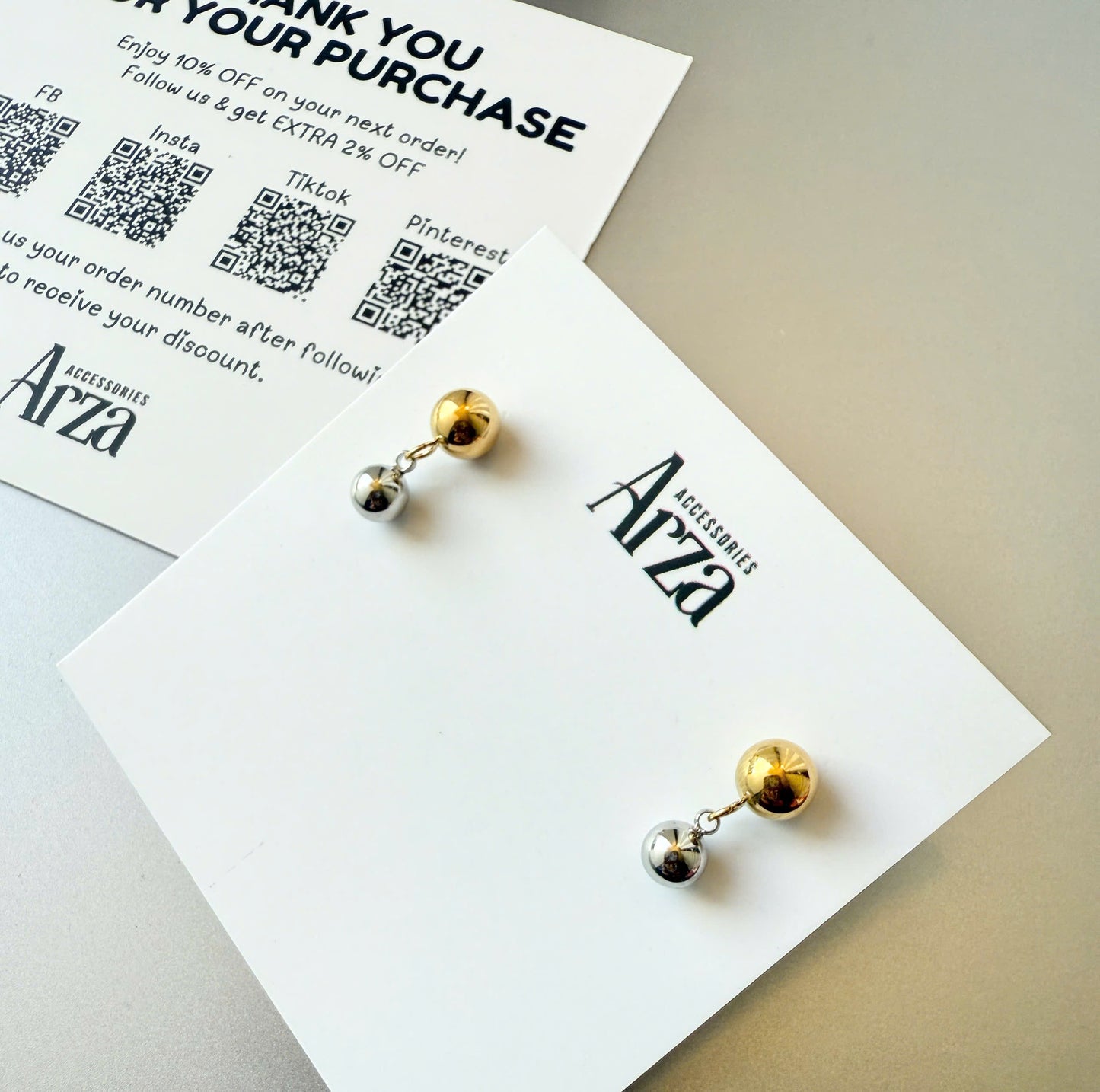 Gold-tone stainless steel round bead stud earrings, 1.46cm diameter, lightweight and hypoallergenic.16