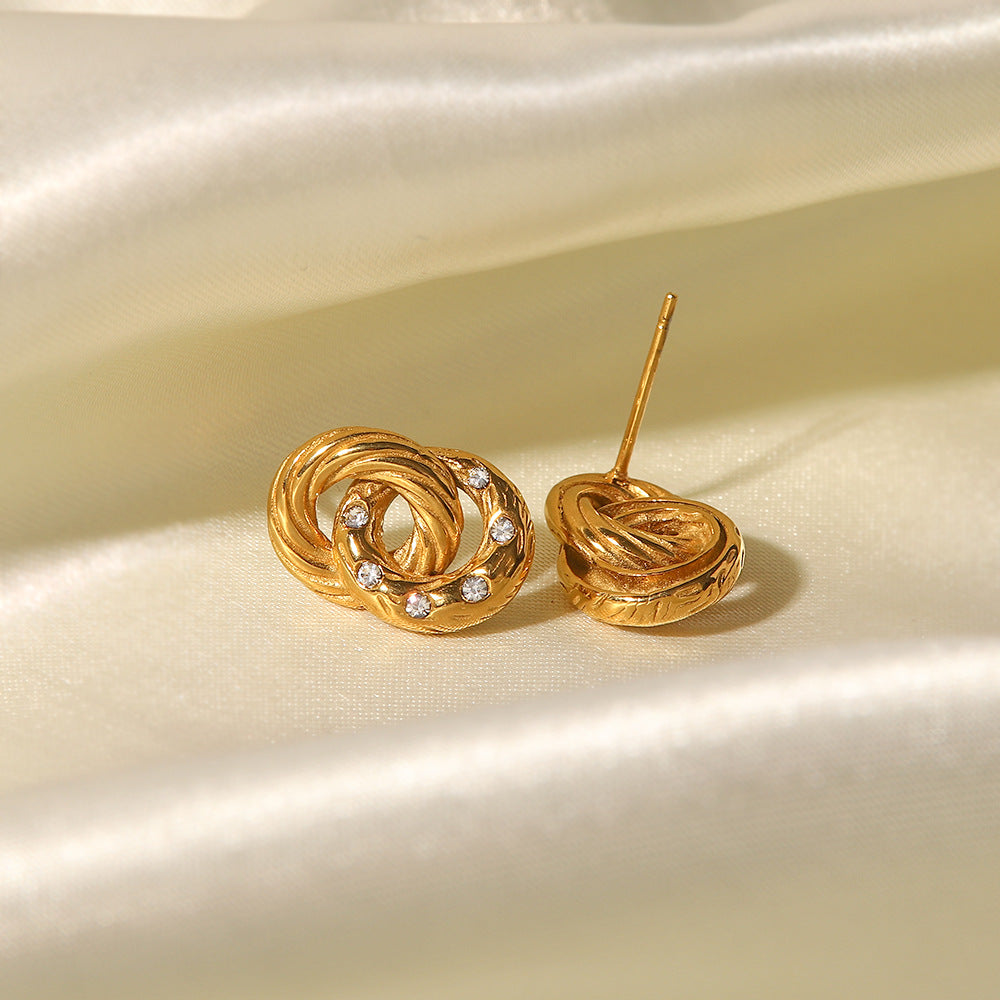 Delicate gold-tone slim hoop earrings (1.1mm) for women, made of lightweight stainless steel. 2