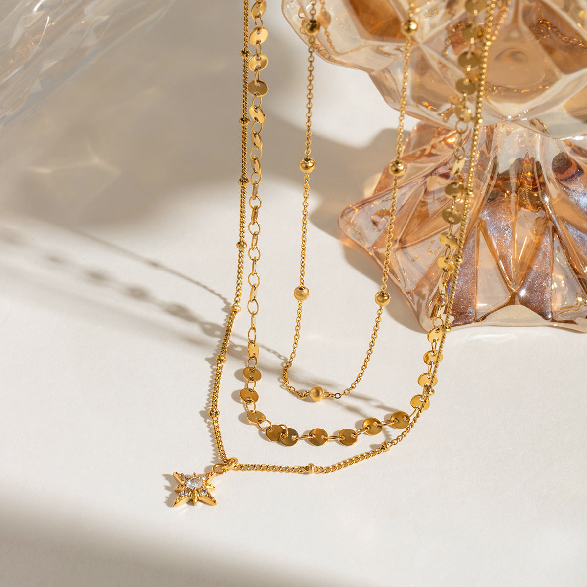 Three gold layered necklaces (40+5cm, 41.5+5cm, 43+5cm) with 1.43cm coin charm, shown in boho styling 5