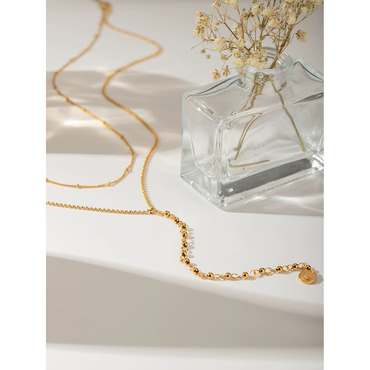 Two-layer gold necklace set showing 40+5cm and 50+5cm chains with 12mm coin charm 4