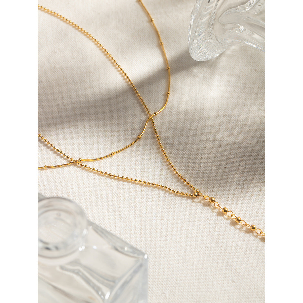 Two-layer gold necklace set showing 40+5cm and 50+5cm chains with 12mm coin charm 3