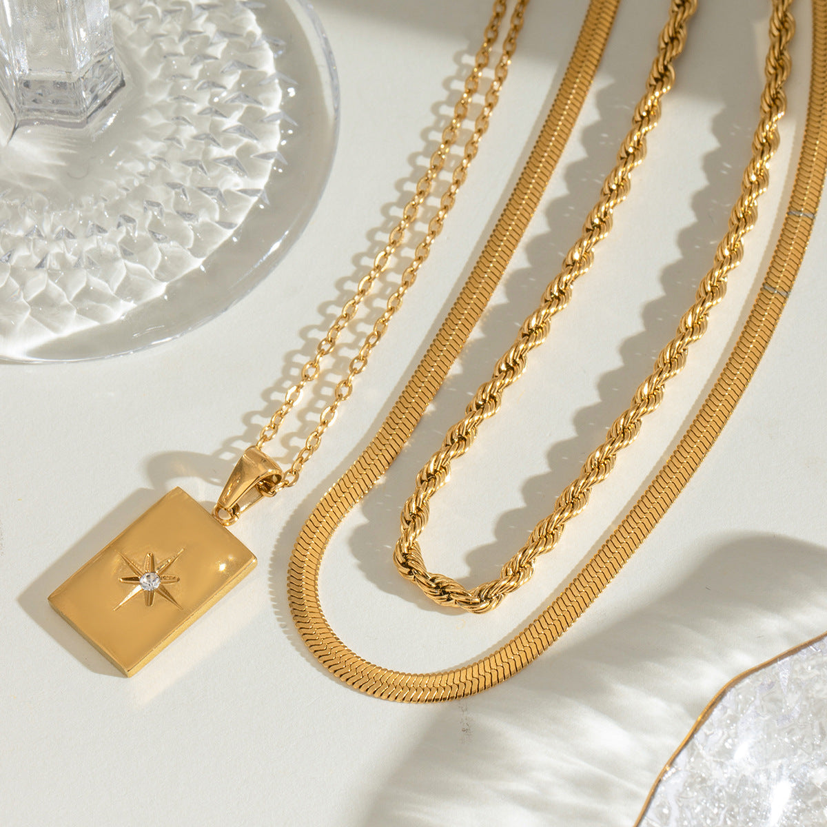 Gold rectangular charm necklace shown at three adjustable lengths (15.7-17.7in) with 20.9g stainless steel chain 6