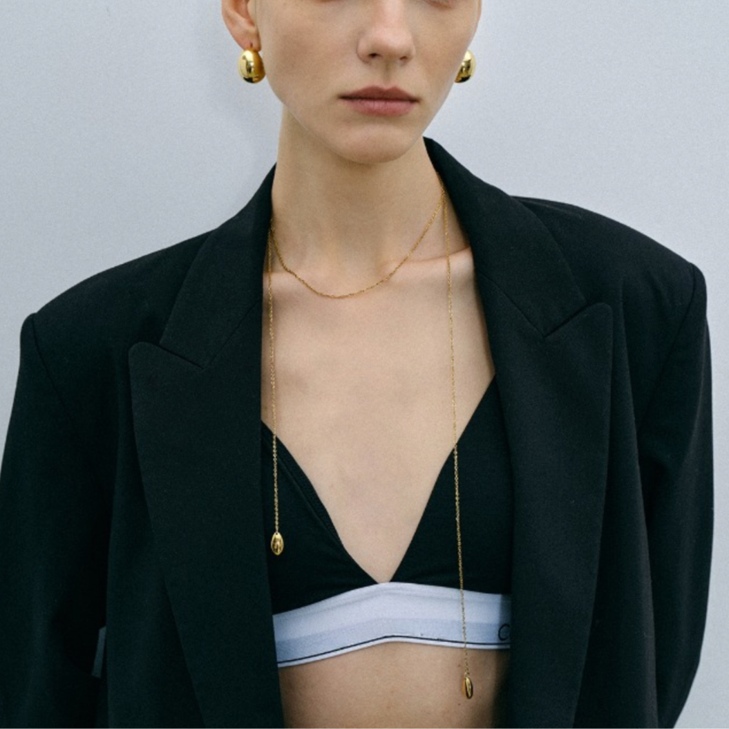 Thin gold adjustable chain necklace (110cm length, 0.8cm width) shown in layered styling 38