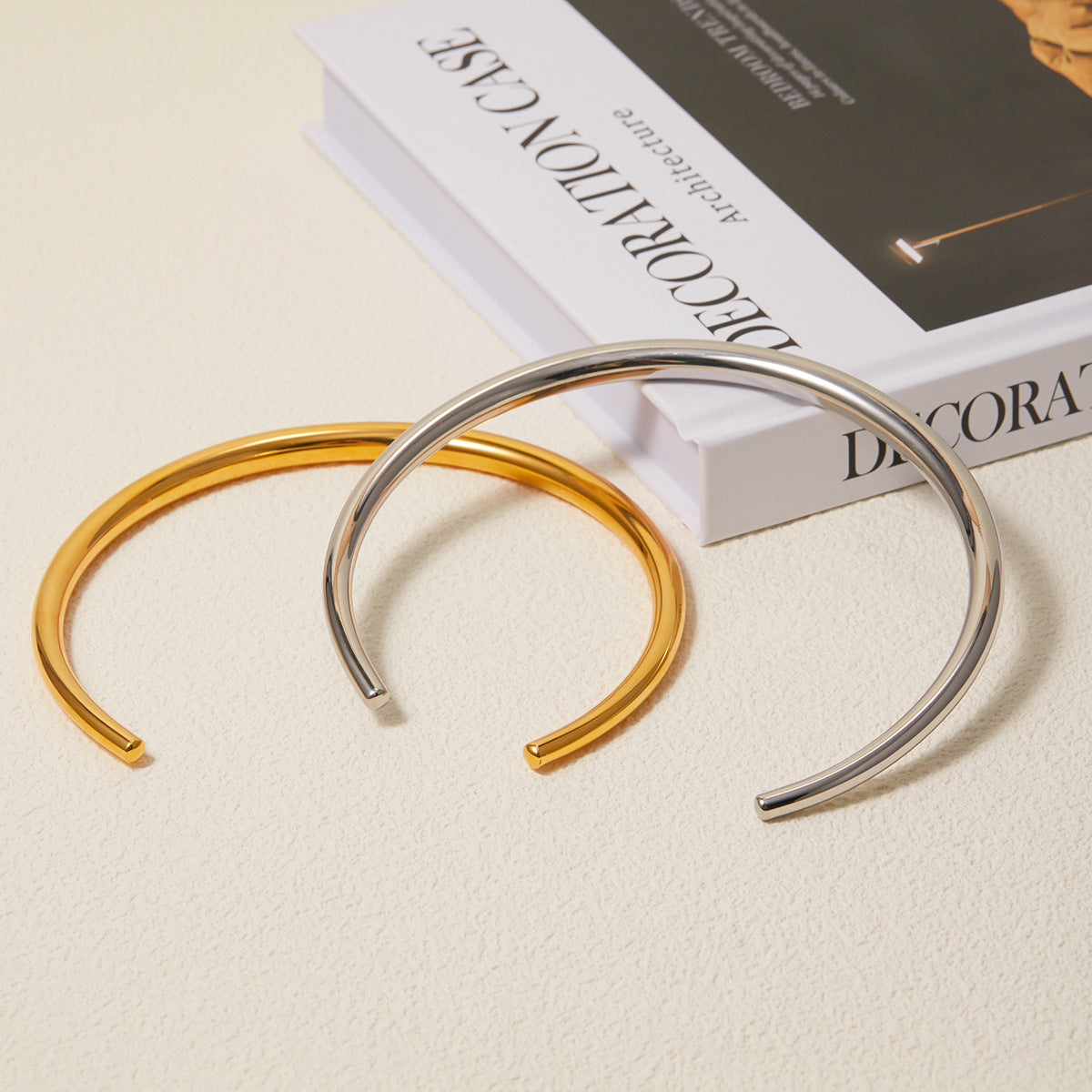 Close-up view of Arza's two-tone adjustable choker necklace showing gold and silver stainless steel links (11.4cm circumference) - 1