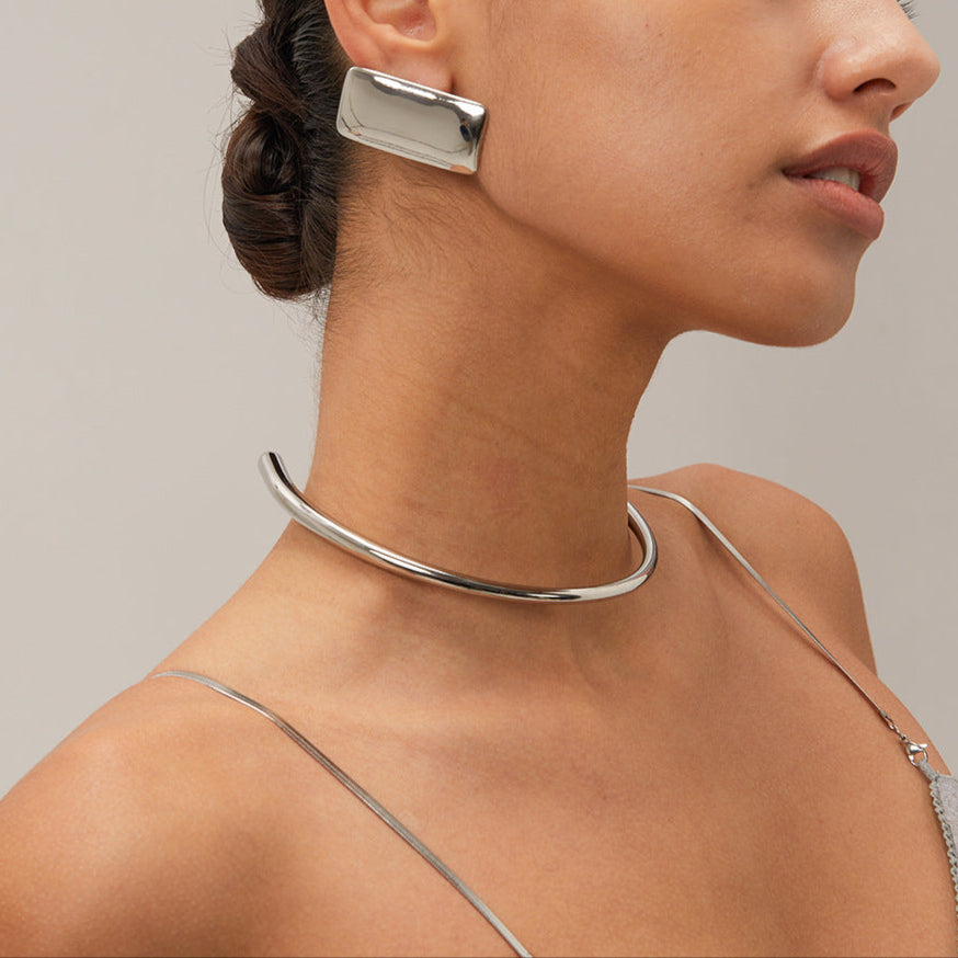 Close-up view of Arza's two-tone adjustable choker necklace showing gold and silver stainless steel links (11.4cm circumference) 13