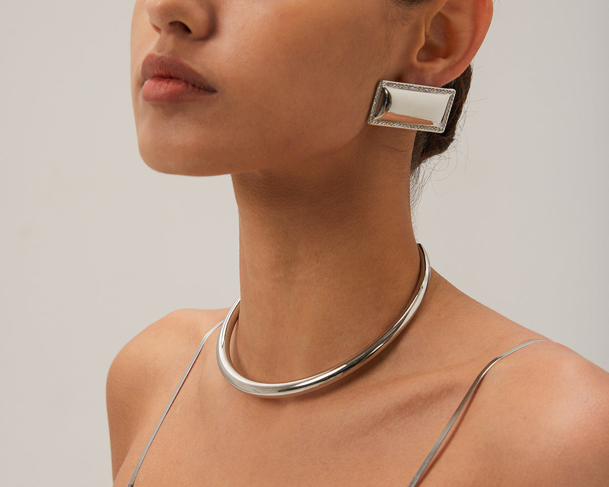 Close-up view of Arza's two-tone adjustable choker necklace showing gold and silver stainless steel links (11.4cm circumference) - 3