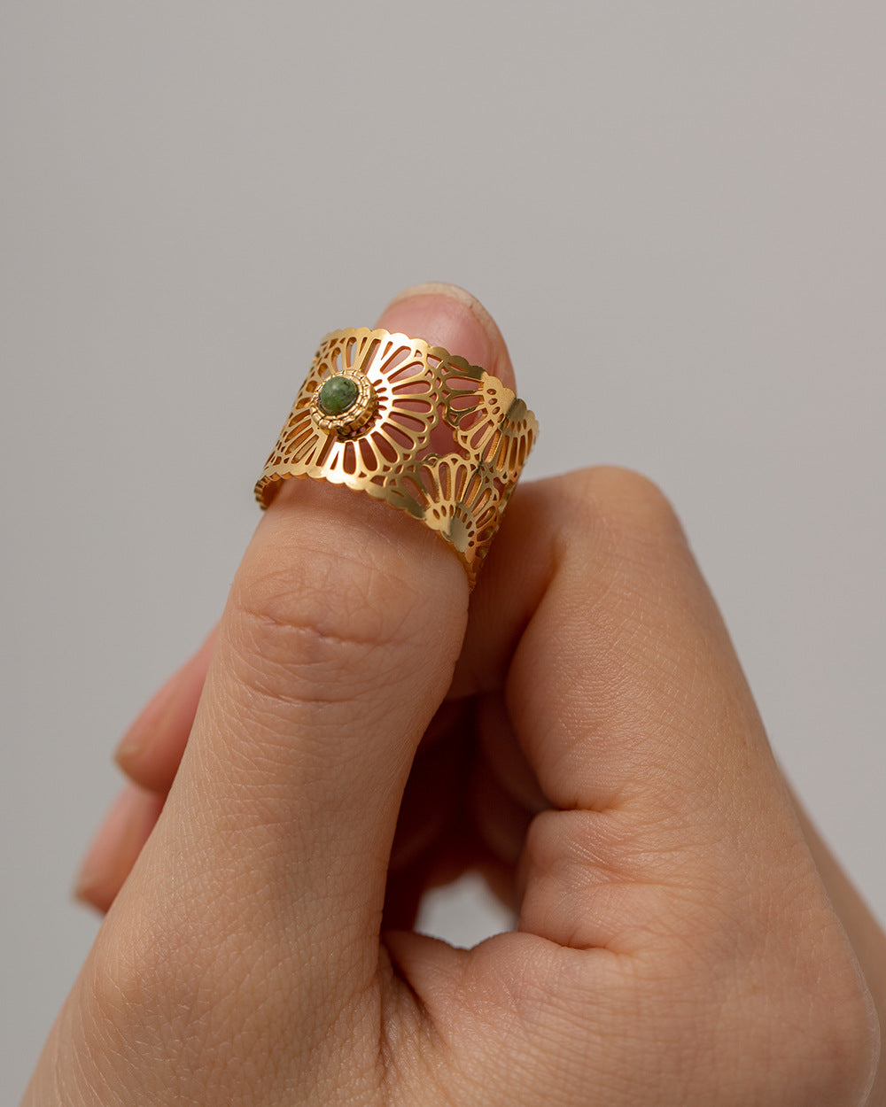 Adjustable hypoallergenic ring with green stone, showcasing delicate and lightweight design-3