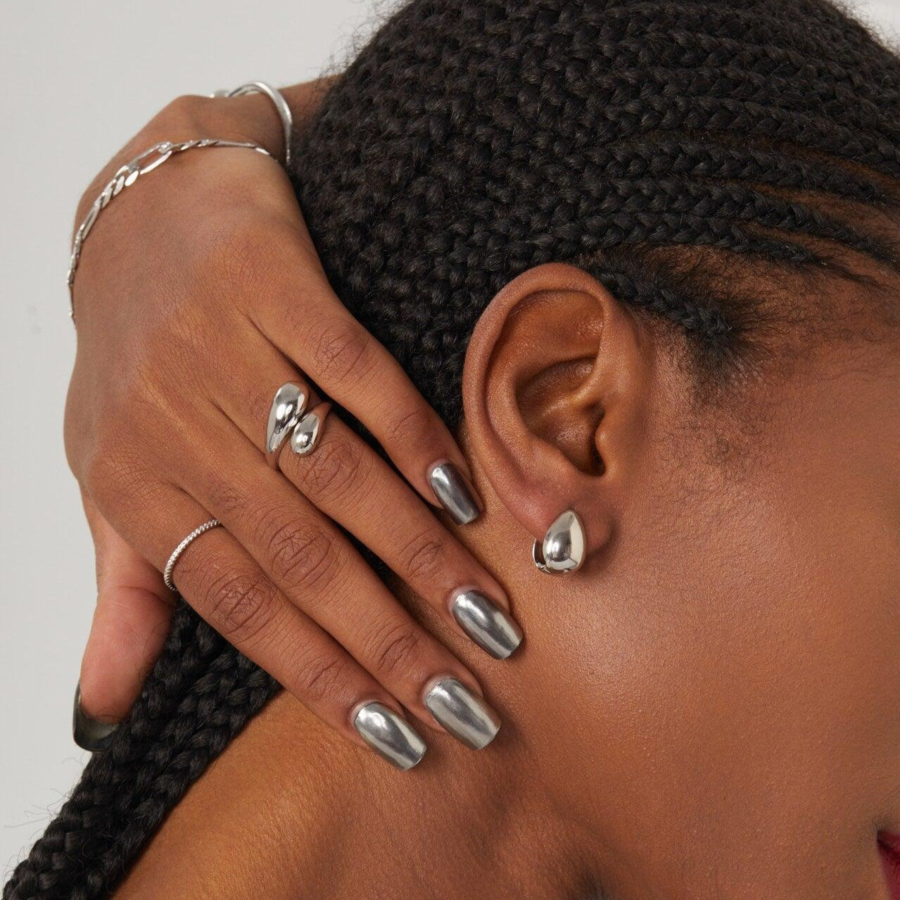 Adjustable teardrop-shaped gold and silver ring with 8mm waterdrop design by Arza Accessories, perfect for everyday or party wear 1