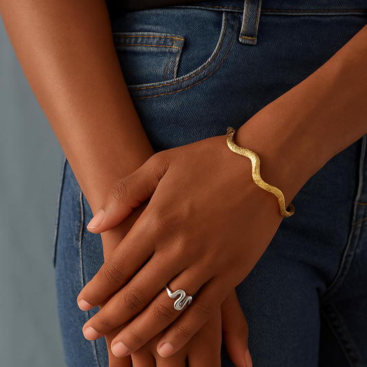 Gold wavy adjustable bracelet (6.1cm diameter, 0.4cm width) shown on wrist 89