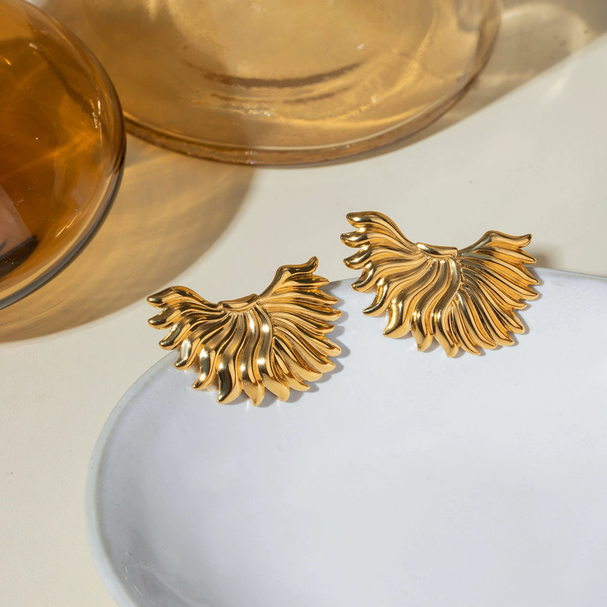 Gold half-sun stud earrings for women, hypoallergenic stainless steel, lightweight casual and party wear. 1

