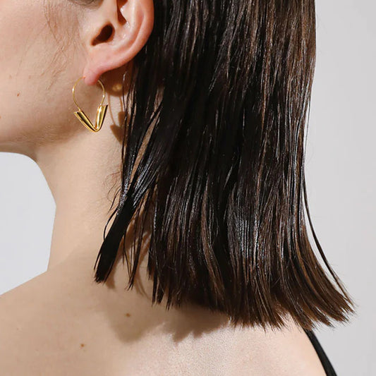 Gold-tone stainless steel arrow hoop earrings, 4.3cm diameter, modern statement jewelry 1