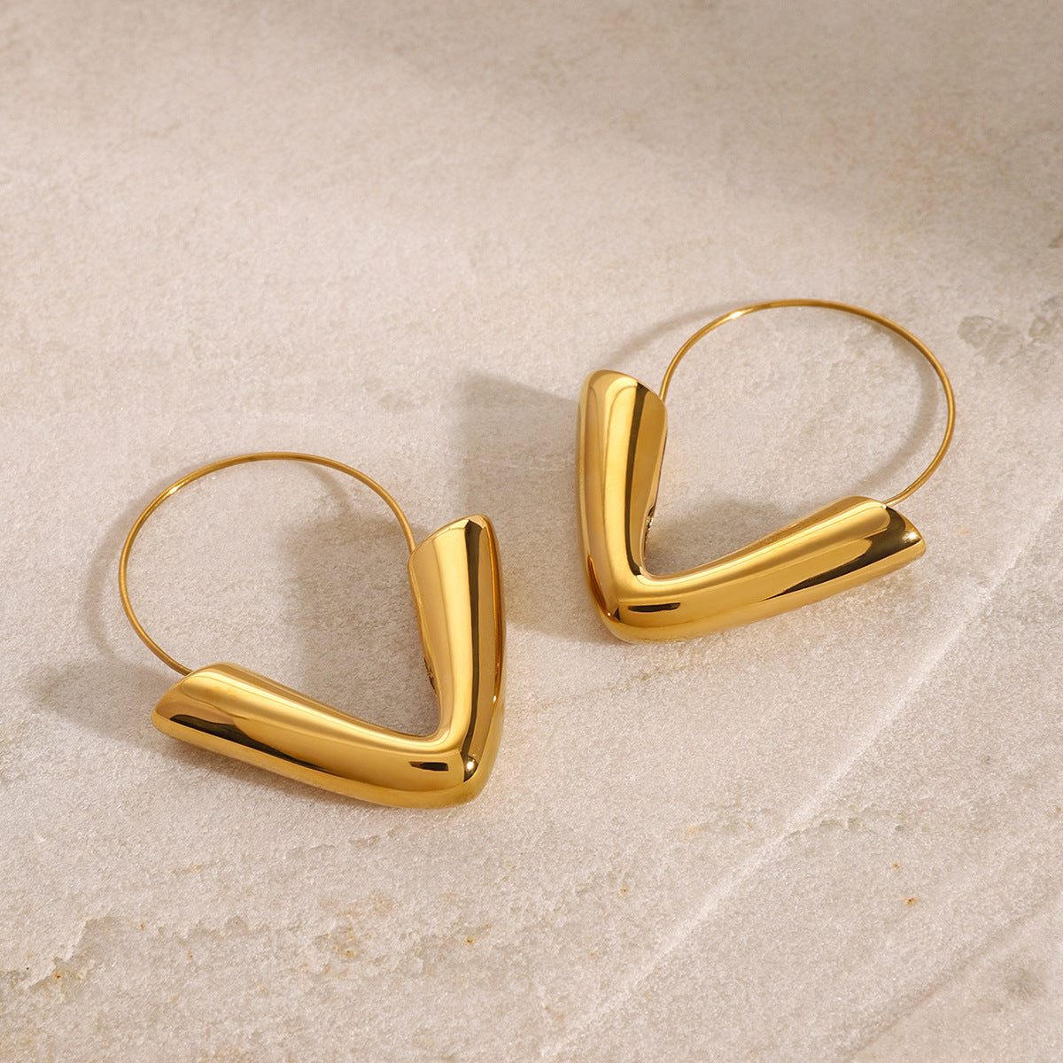 Gold-tone stainless steel arrow hoop earrings, 4.3cm diameter, modern statement jewelry 2