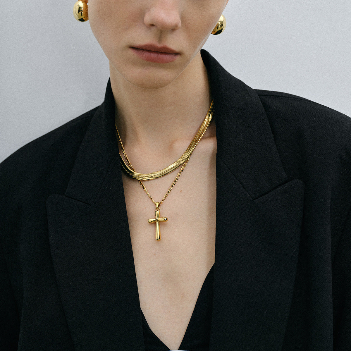 Gold-tone cross pendant necklace with 50cm chain, stainless steel, waterproof, and hypoallergenic design for women. 10