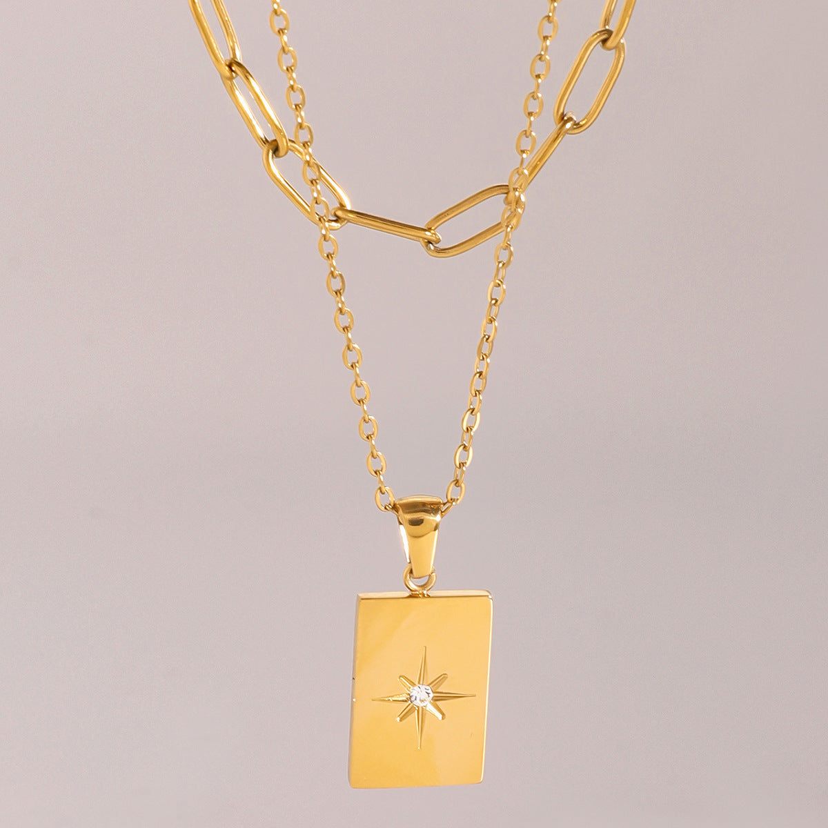 Gold-tone rectangle pendant necklace set with white stones, featuring two-layer stainless steel chains for women. 2