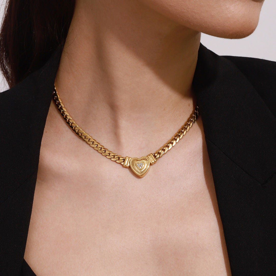 Gold-tone stainless steel heart pendant choker necklace with adjustable chain for women. 1