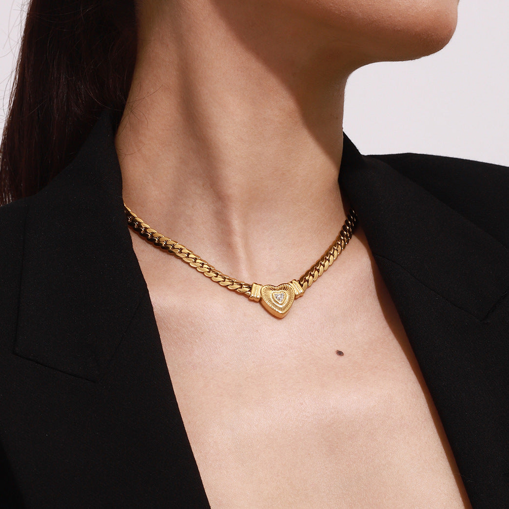Gold-tone stainless steel heart pendant choker necklace with adjustable chain for women. 4