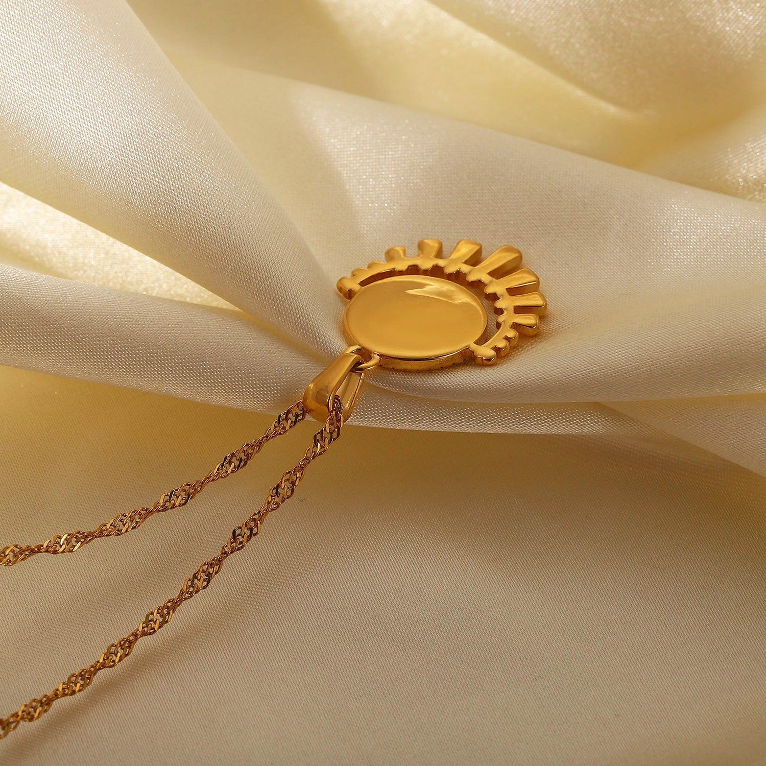 Gold-tone sun pendant necklace with layered chain, adjustable length, and trendy design for women. 5