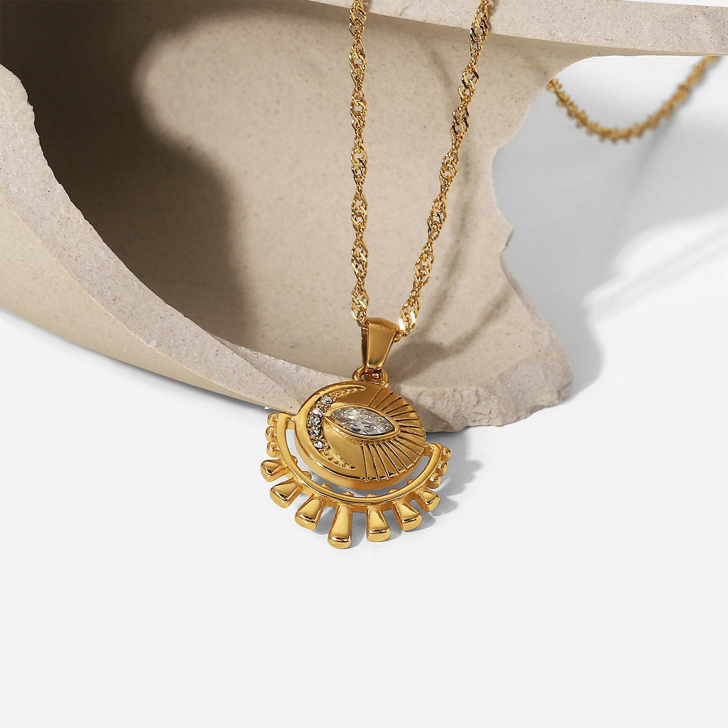 Gold-tone sun pendant necklace with layered chain, adjustable length, and trendy design for women. 7