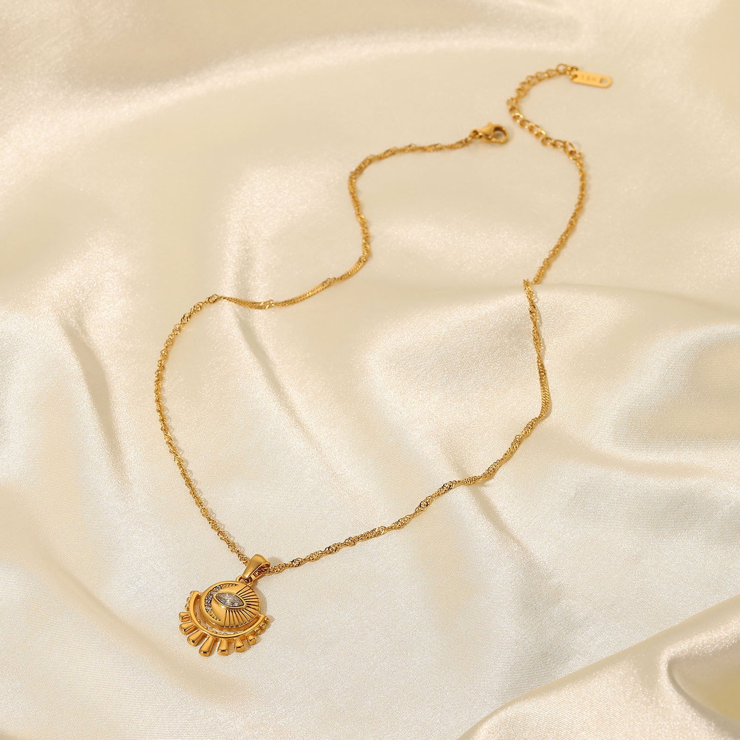 Gold-tone sun pendant necklace with layered chain, adjustable length, and trendy design for women. 8