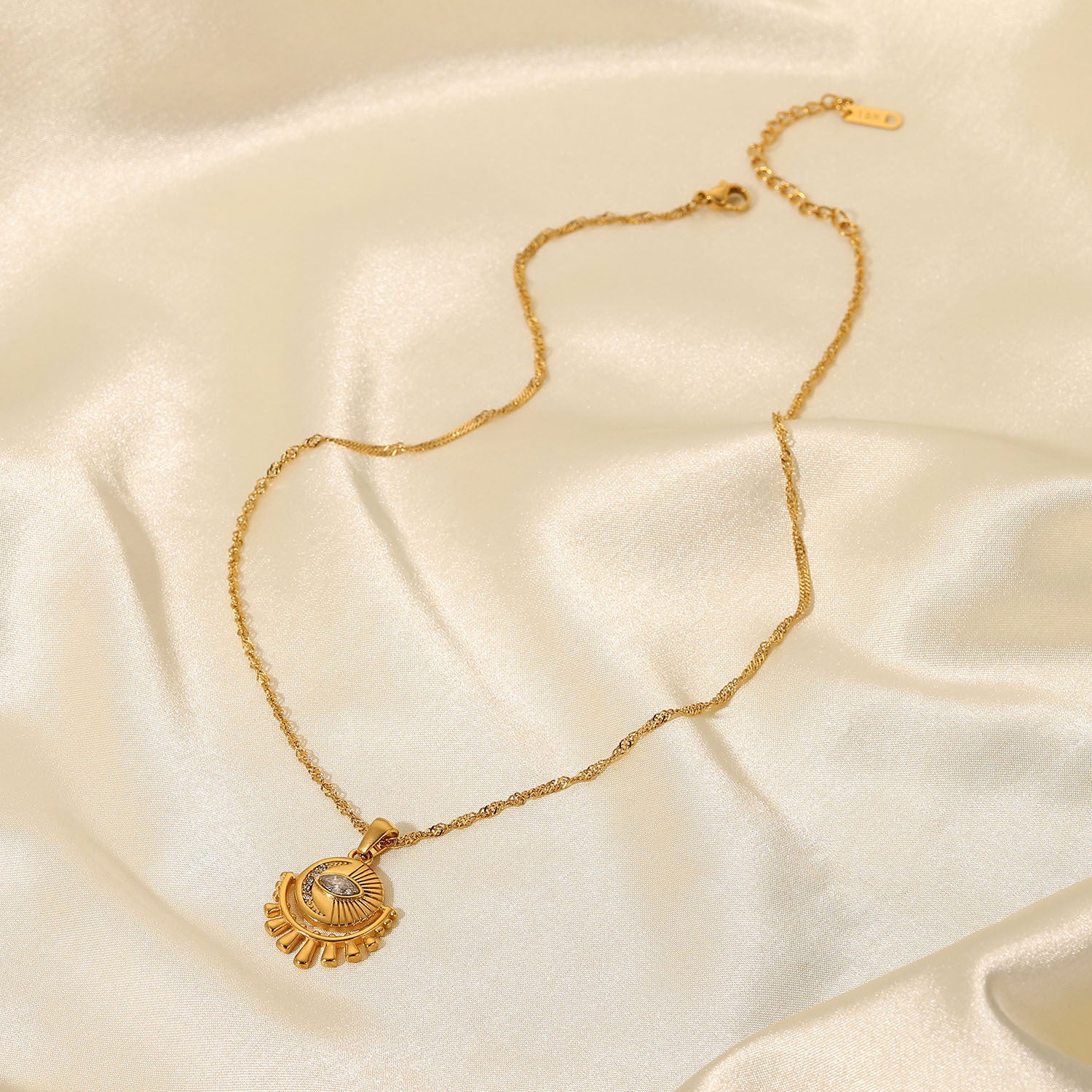 Gold-tone sun pendant necklace with layered chain, adjustable length, and trendy design for women. 8