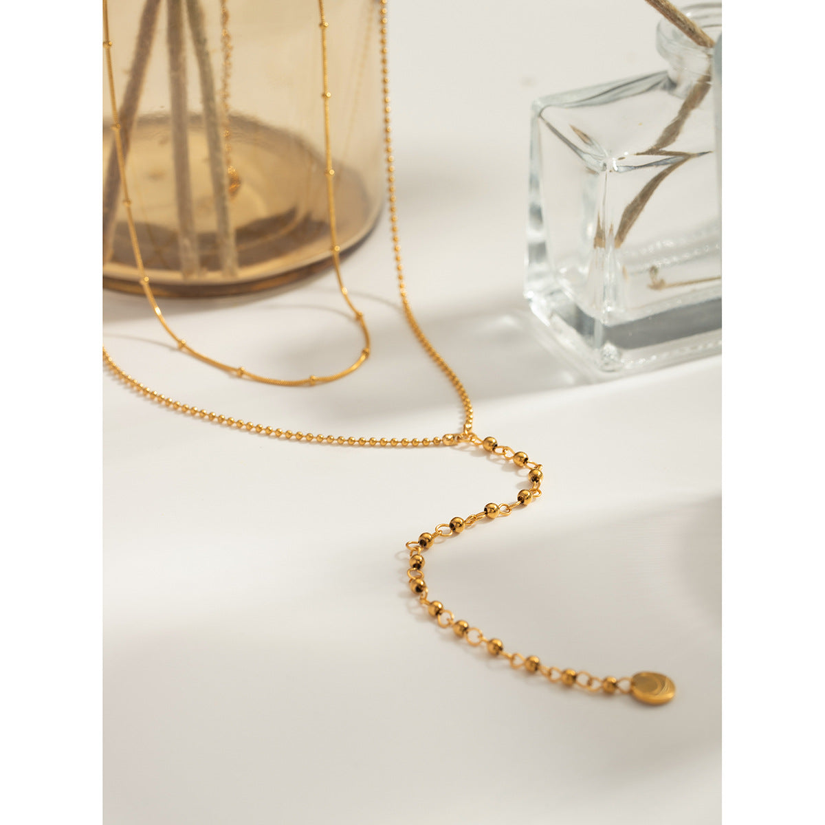 Two-layer gold necklace set showing 40+5cm and 50+5cm chains with 12mm coin charm 8