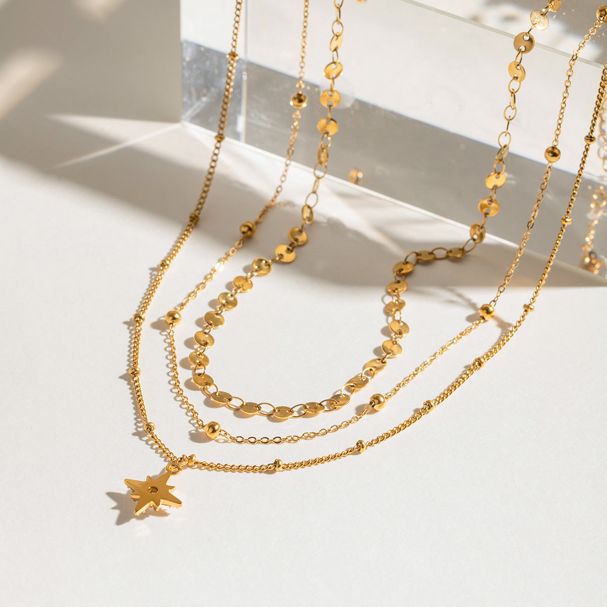 Three gold layered necklaces (40+5cm, 41.5+5cm, 43+5cm) with 1.43cm coin charm, shown in boho styling 4