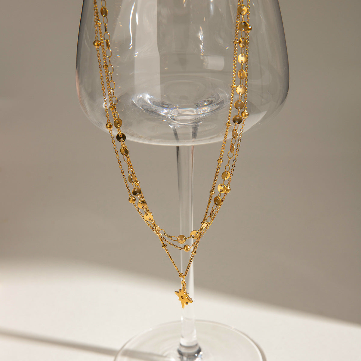 Three gold layered necklaces (40+5cm, 41.5+5cm, 43+5cm) with 1.43cm coin charm, shown in boho styling 6