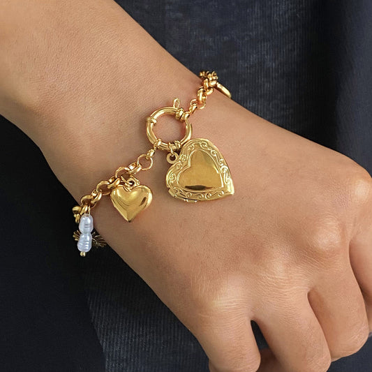 Gold adjustable heart charm bracelet by Azra Accessories – perfect for everyday wear and gifting. 1