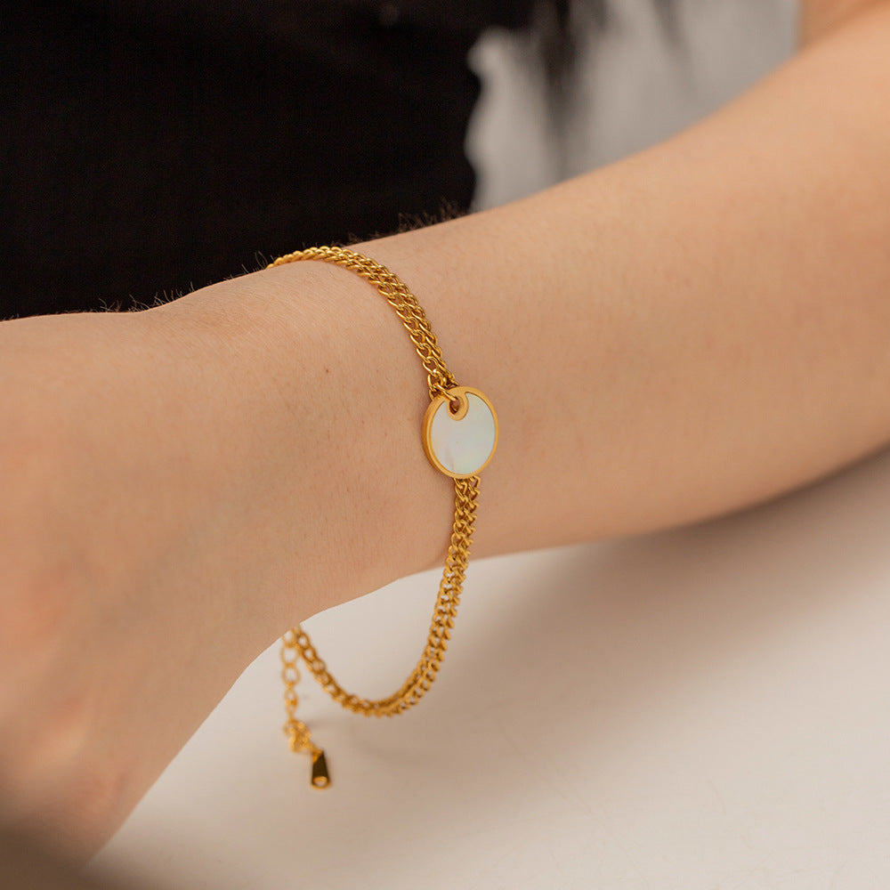 Delicate gold adjustable bracelet (17.5+4cm) with 1.27cm mother-of-pearl charm shown on wrist 4