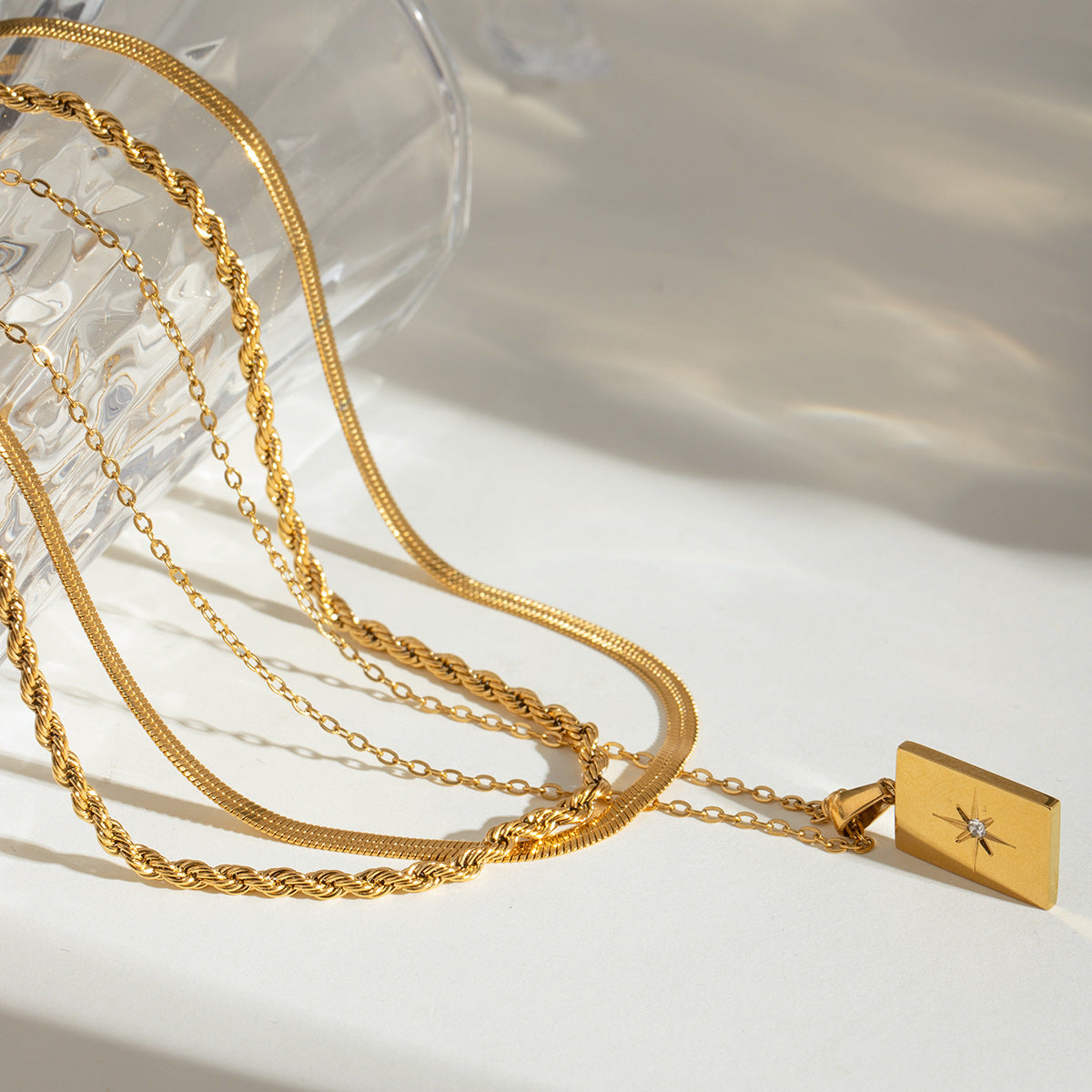 Gold rectangular charm necklace shown at three adjustable lengths (15.7-17.7in) with 20.9g stainless steel chain 3