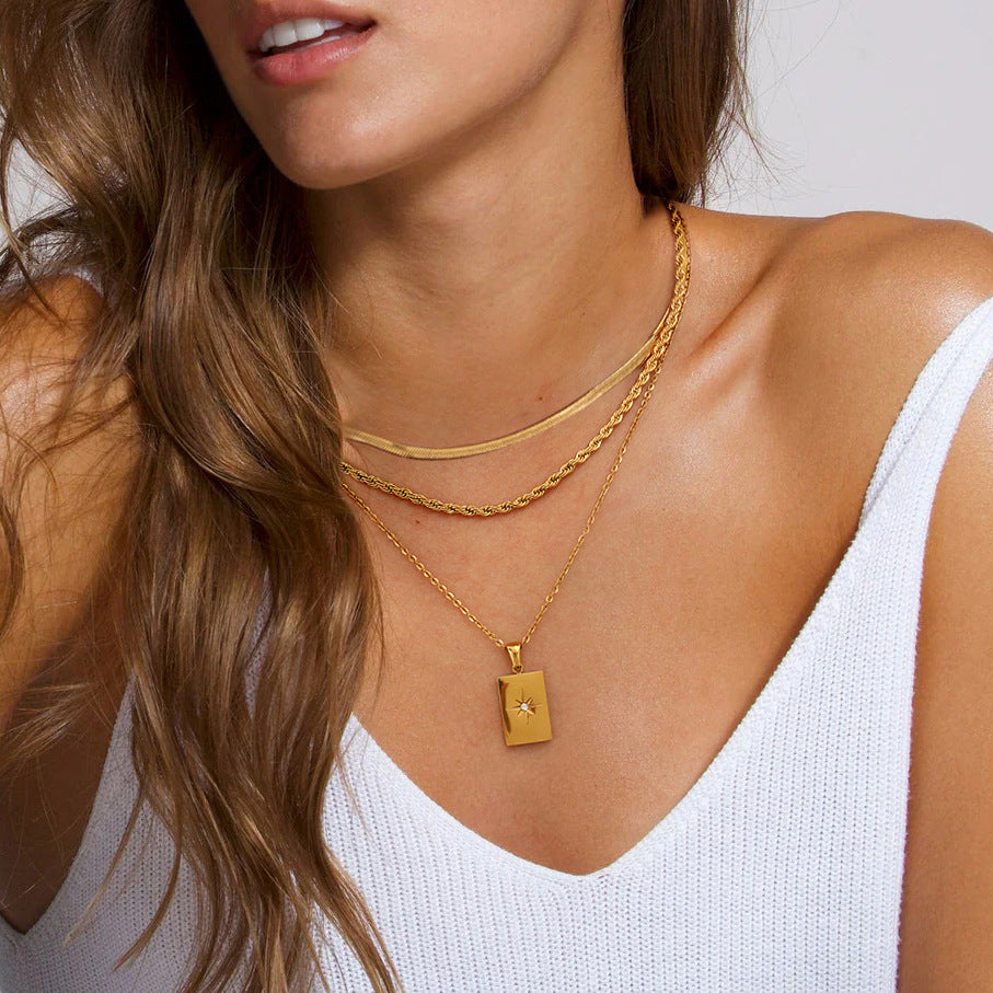 Gold rectangular charm necklace shown at three adjustable lengths (15.7-17.7in) with 20.9g stainless steel chain 1