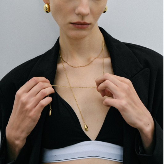 Thin gold adjustable chain necklace (110cm length, 0.8cm width) shown in layered styling 36